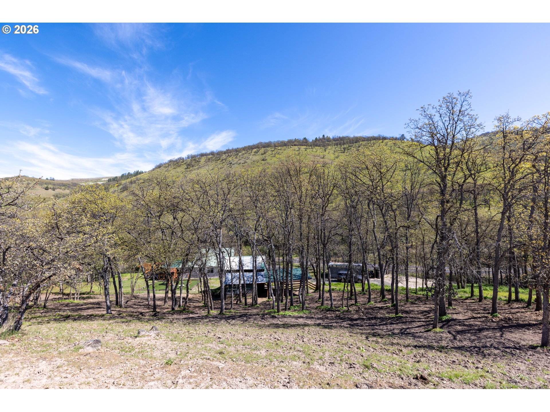 4625 Orchard Road The Dalles, OR 97058 - Photo 27 of 31 a view of a yard with a house in the background