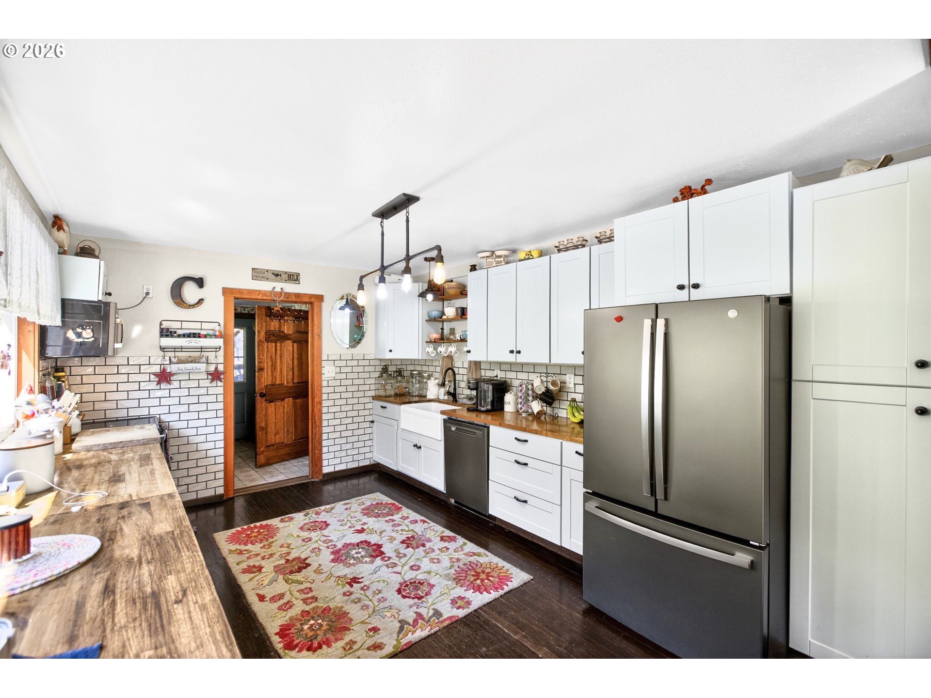 4625 Orchard Road The Dalles, OR 97058 - Photo 3 of 31 a kitchen with stainless steel appliances kitchen island granite countertop a refrigerator and a stove