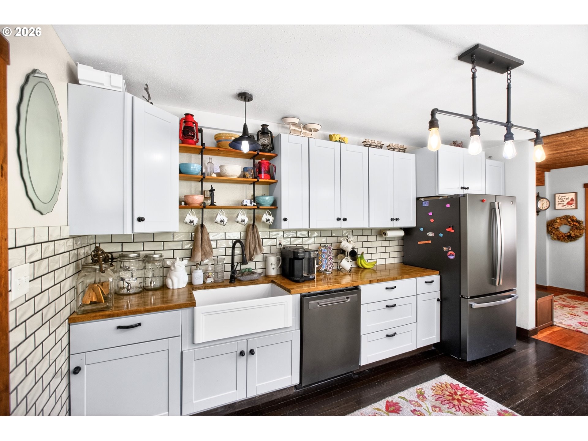 4625 Orchard Road The Dalles, OR 97058 - Photo 4 of 31 a kitchen with white cabinets and sink