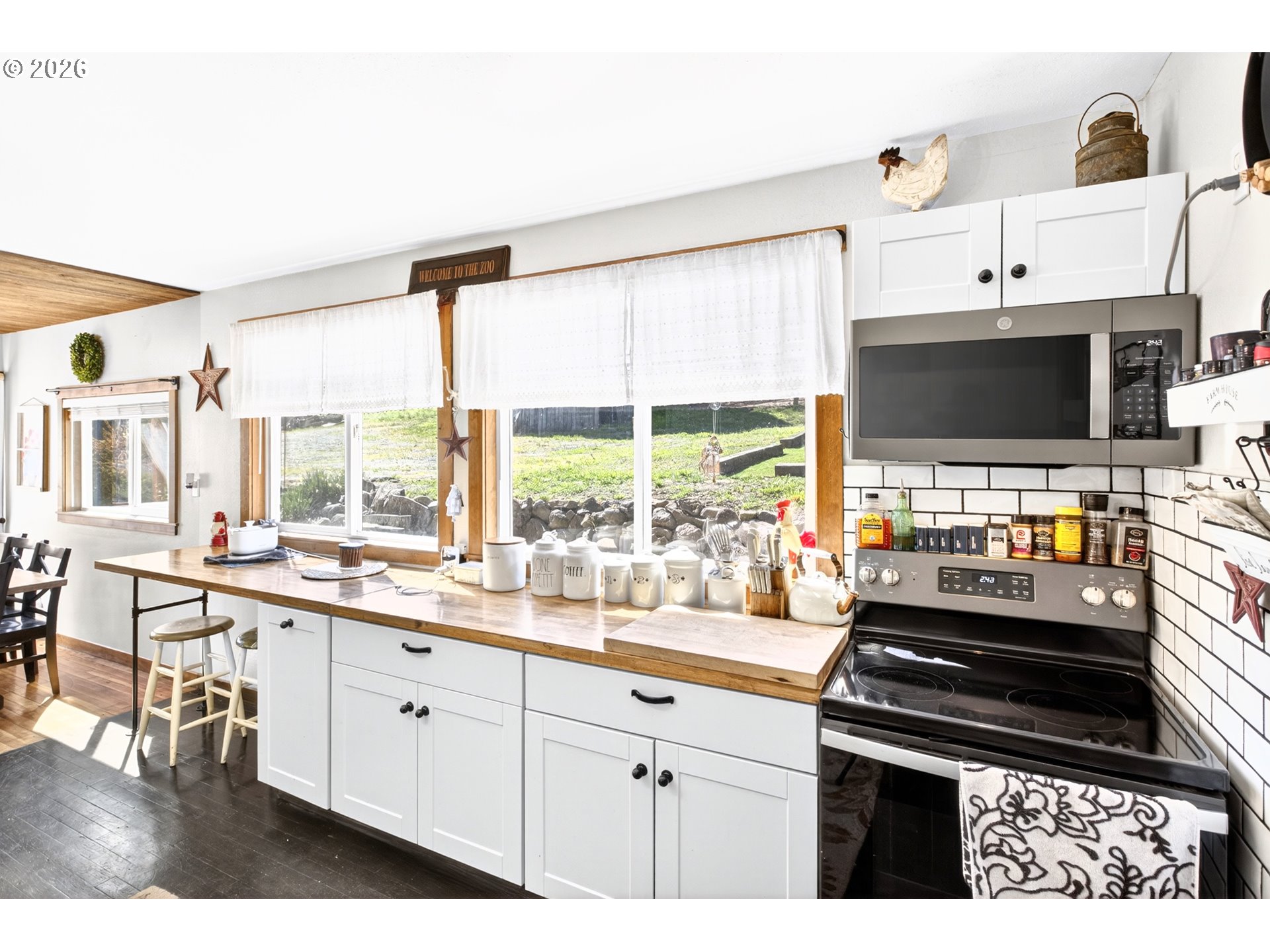 4625 Orchard Road The Dalles, OR 97058 - Photo 5 of 31 a kitchen with a stove a sink and a microwave