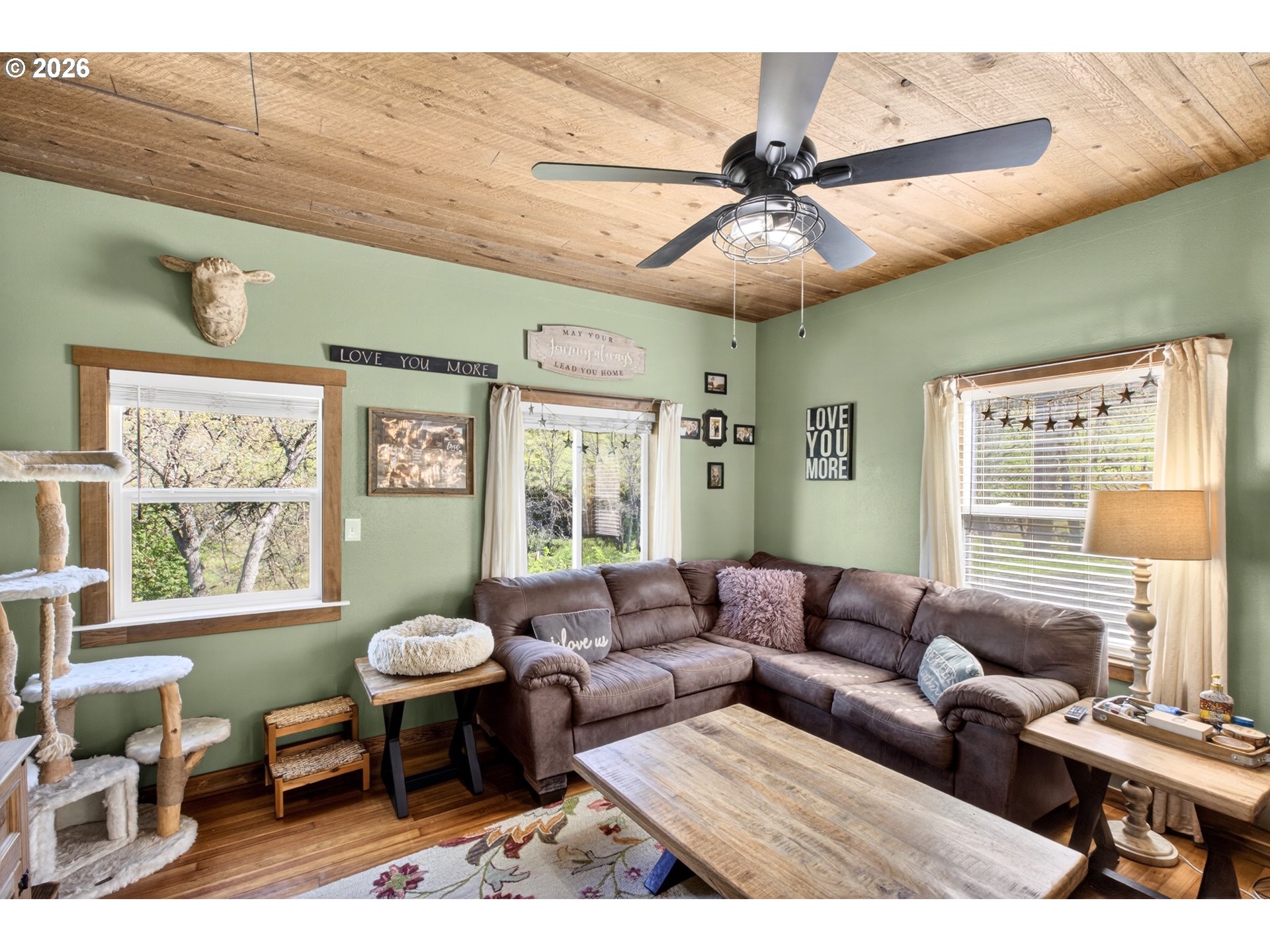 4625 Orchard Road The Dalles, OR 97058 - Photo 7 of 31 a living room with furniture a ceiling fan and a window