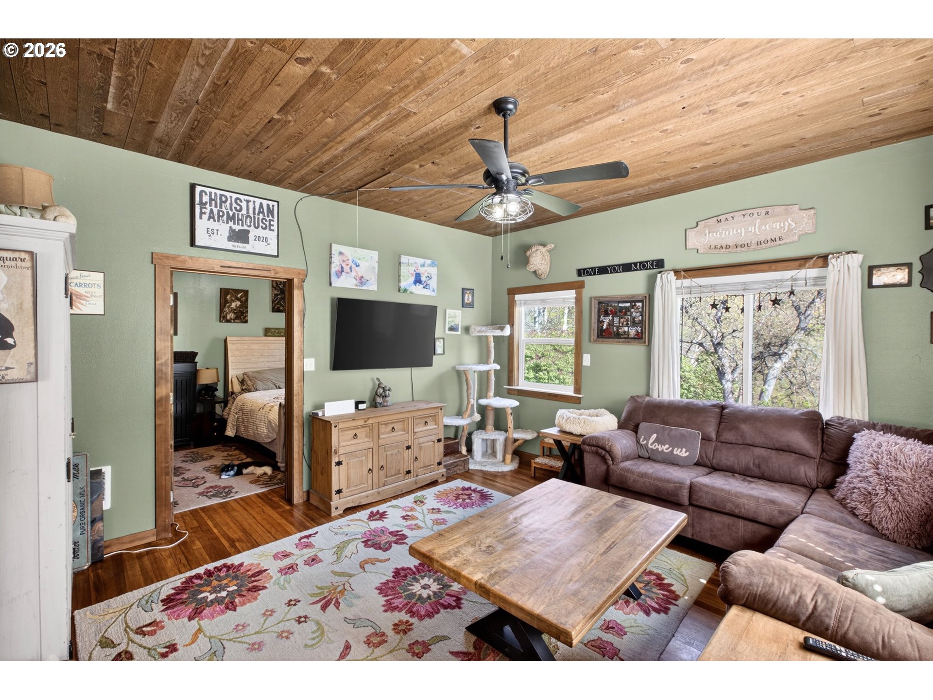 4625 Orchard Road The Dalles, OR 97058 - Photo 8 of 31 a living room with furniture and a flat screen tv