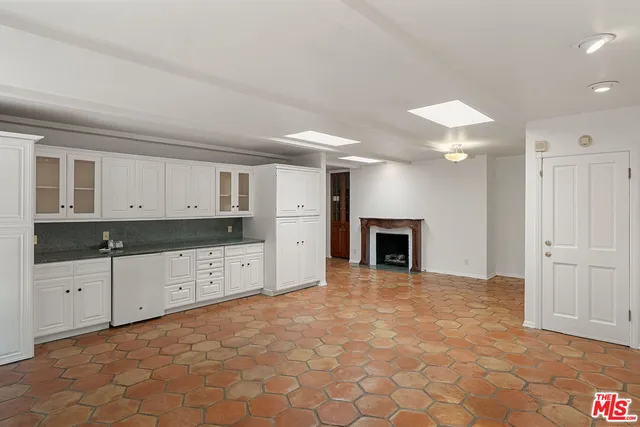 a view of a kitchen with furniture and a fireplace