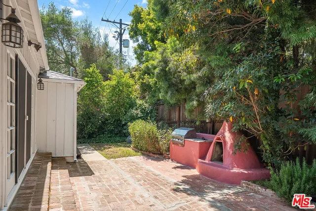 a view of a backyard with sitting area