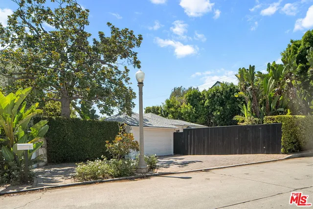 front view of a house with a street