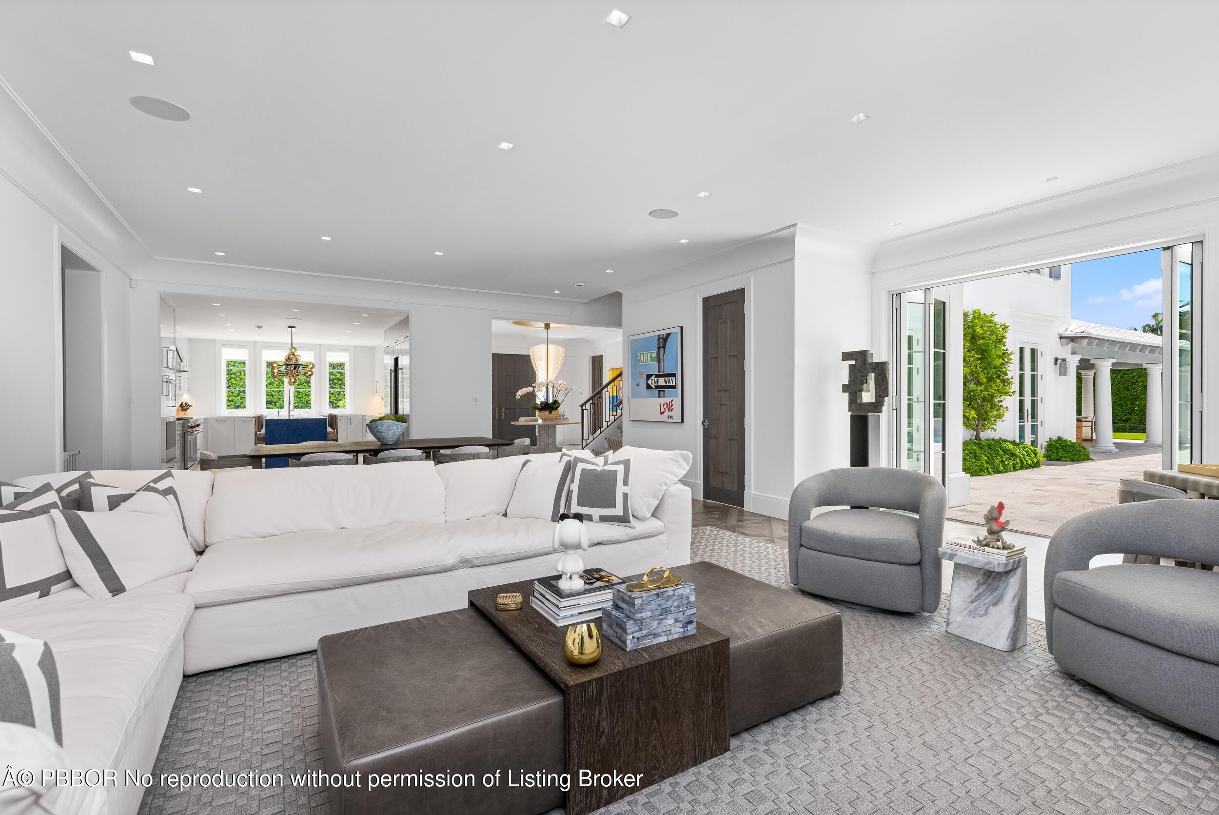 201 Banyan Road Palm Beach, FL 33480 - Photo 11 of 42 a living room with furniture and a large window
