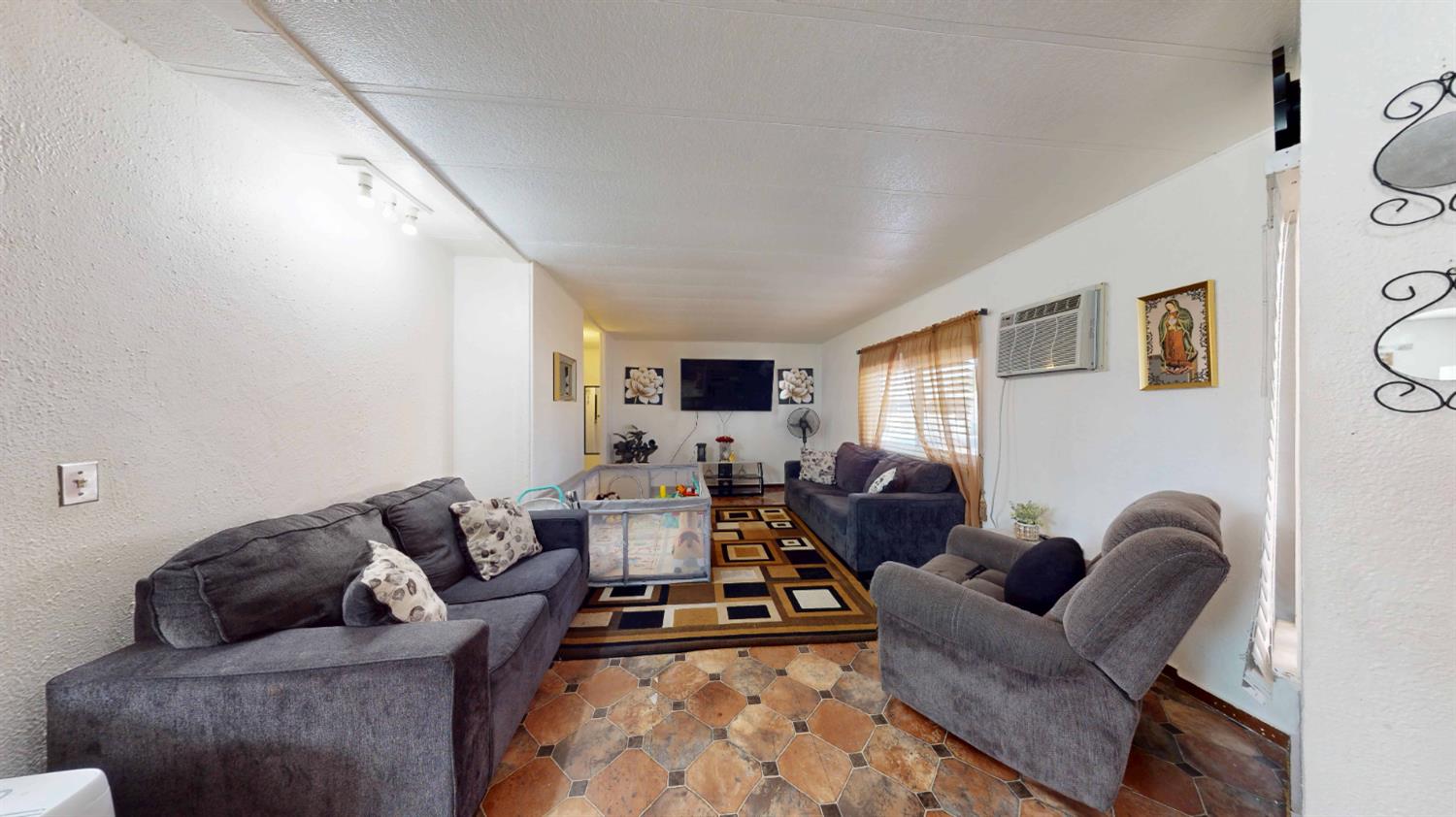 5200 Crest Road, Unit 96 Atwater, CA 95301 - Photo 7 of 15 a living room with furniture or couch and a flat screen tv