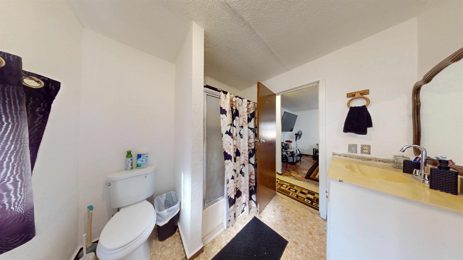 5200 Crest Road, Unit 96 Atwater, CA 95301 - Photo 9 of 15 a bathroom with a sink mirror vanity and toilet
