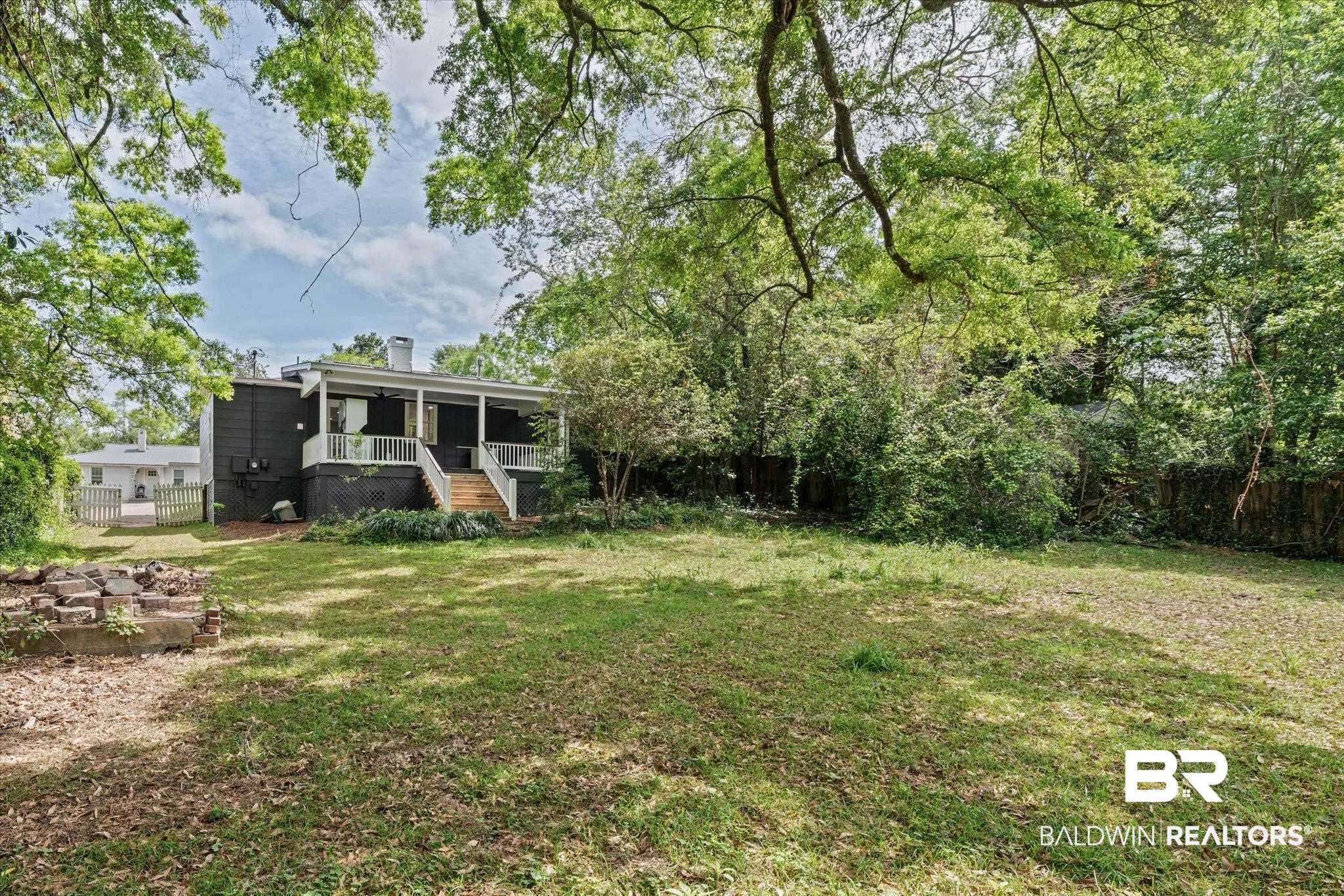 41 Hathaway Road West Mobile, AL 36608 - Photo 20 of 24 Fenced backyard featuring stairs and covered porch