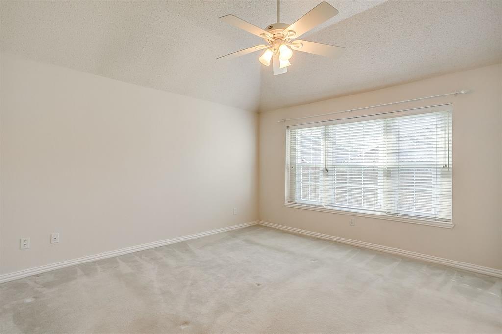 8105 Hosta Way Fort Worth, TX 76123 - Photo 20 of 33 an empty room with a window and a fan