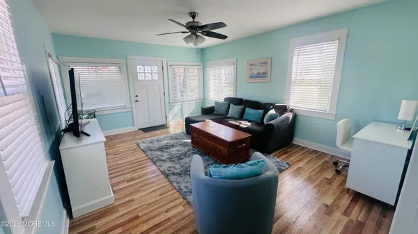 a living room with furniture and a rug