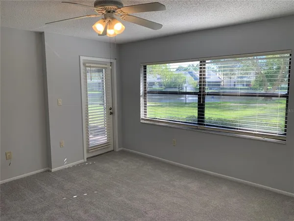 a view of an empty room with a window