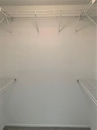a view of a room with racks on the wall