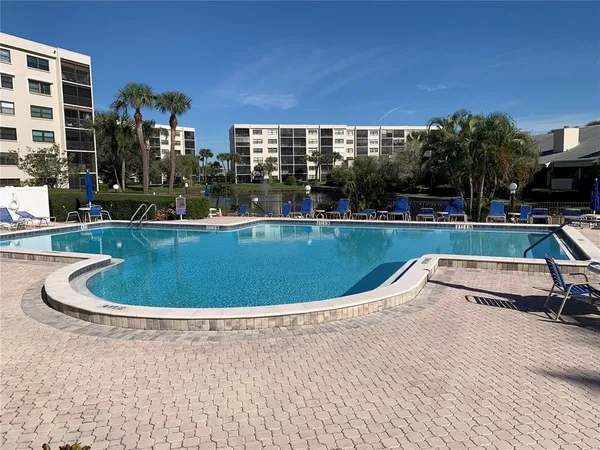 a view of swimming pool with seating space