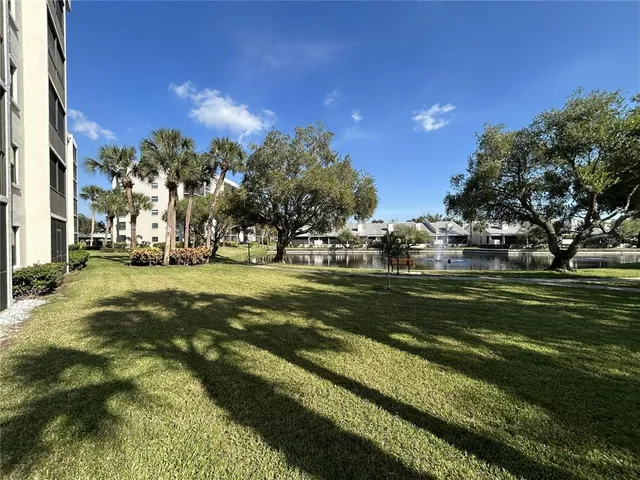 a view of a lake with a bench and lake view