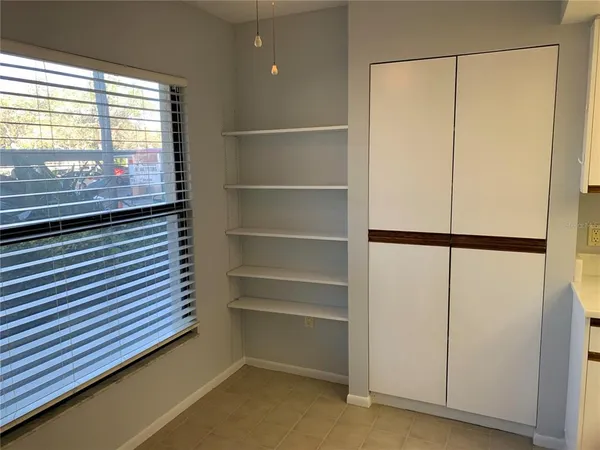a bathroom with a shower and a window