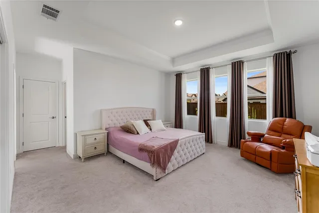 a bathroom with a granite countertop sink a mirror and shower