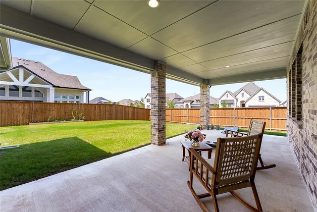 a view of a patio with swimming pool