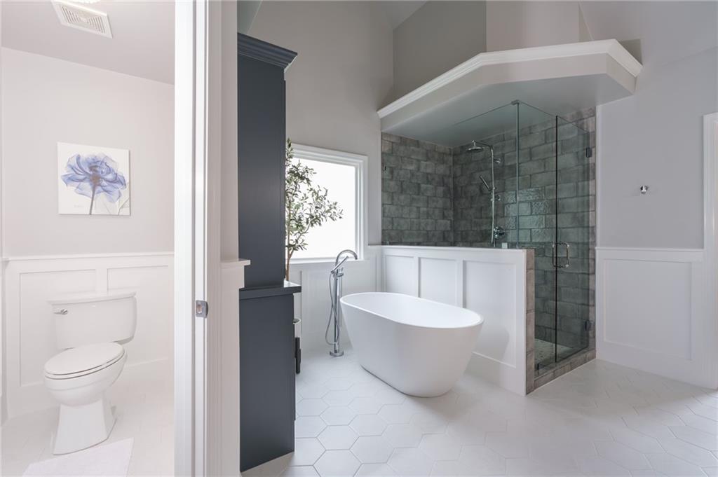 4330 Farmbrook Lane Cumming, GA 30041 - Photo 27 of 46 a spacious bathroom with a toilet and a bathtub