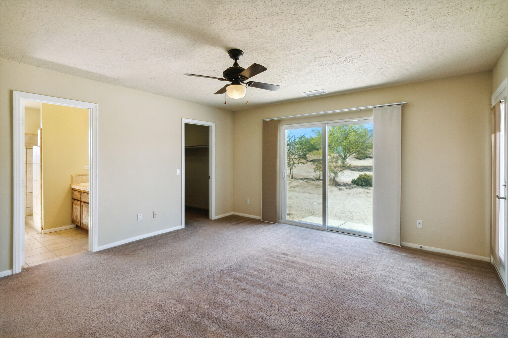 381 Calaveras Road Pinon Hills, CA 92372 - Photo 14 of 27 a view of empty room with ceiling fan