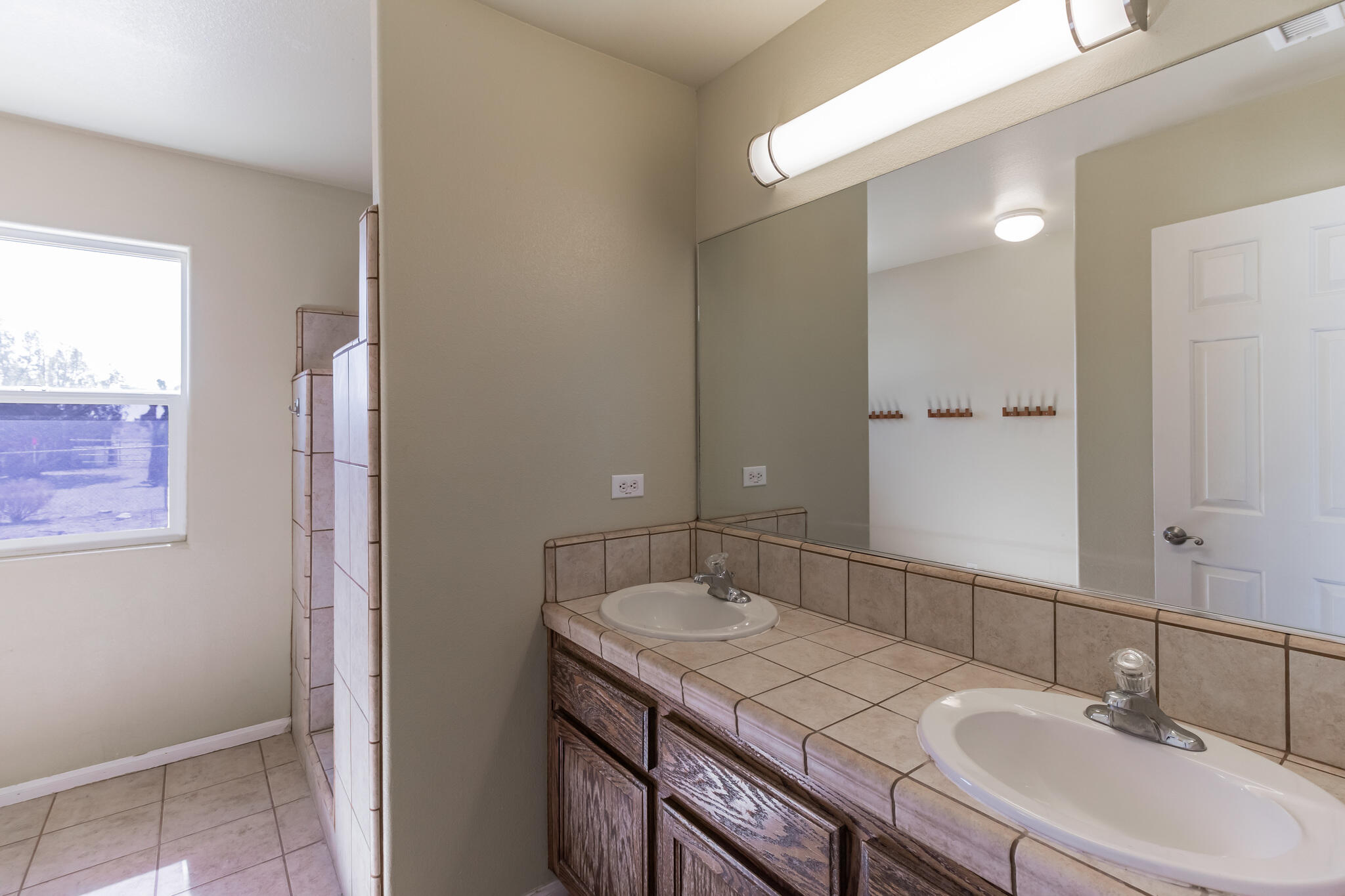 381 Calaveras Road Pinon Hills, CA 92372 - Photo 18 of 27 a bathroom with a sink and a mirror