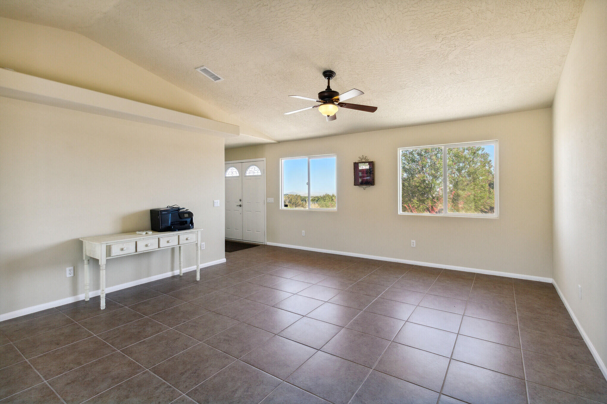 381 Calaveras Road Pinon Hills, CA 92372 - Photo 4 of 27 a view of an empty room with a window and cabinet