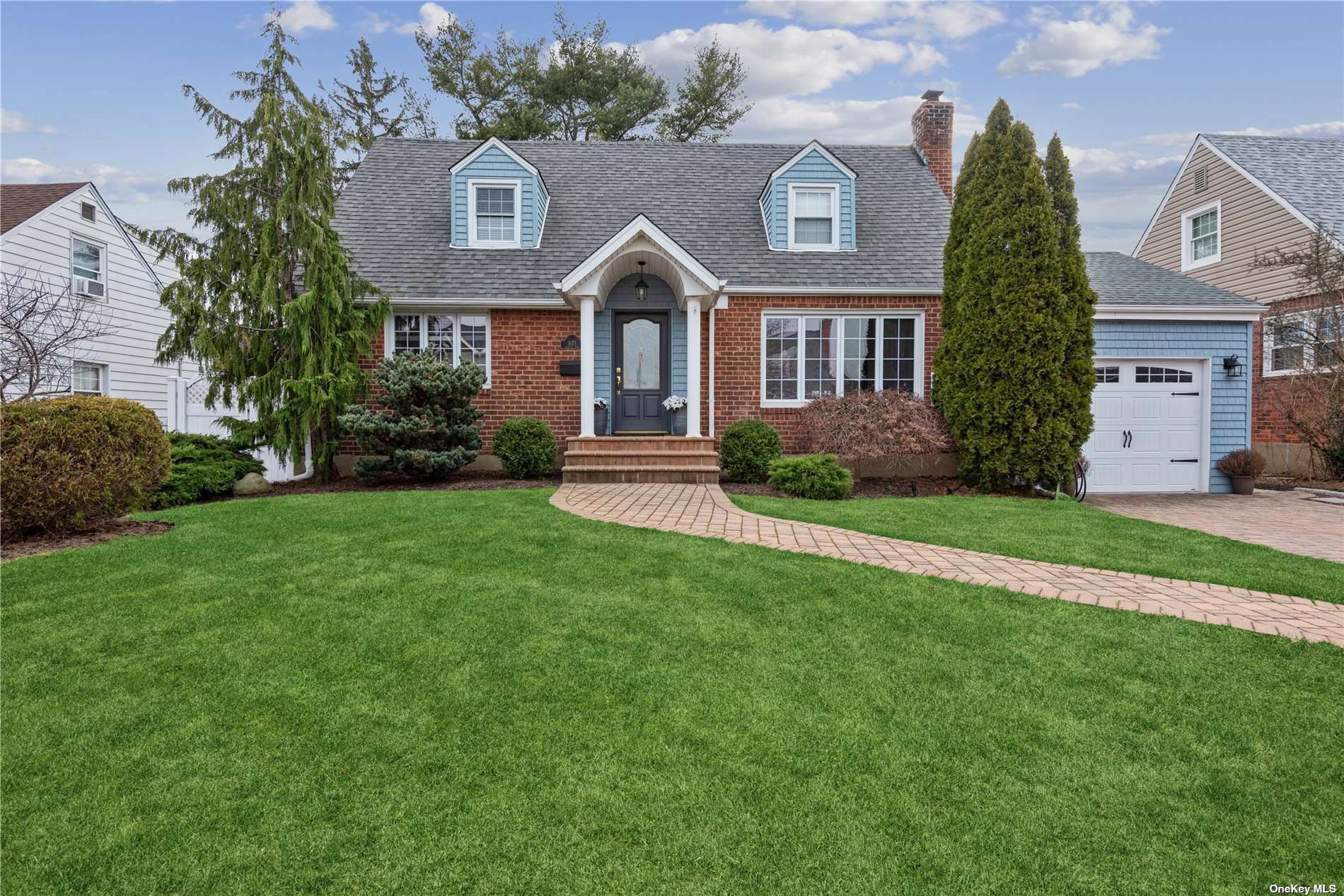 1075 Harrow Road Franklin Square, NY 11010 - Photo 1 of 1 a front view of a house with a yard and garage