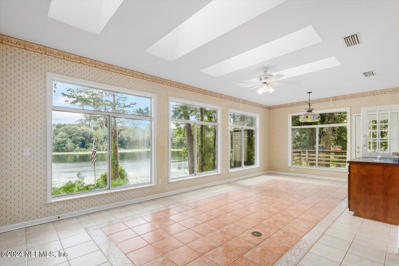 8495 Lilly Lake Road Melrose, FL 32666 - Photo 19 of 60 Enclosed Sunroom