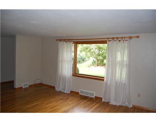 952 Hurst Road Youngwood, PA 15601 - Photo 11 of 18 Living Room. with large picture window and hardwood floor