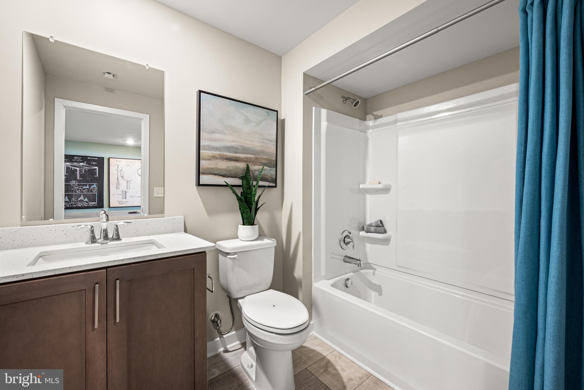 548 Arrowgrass Lane New Castle, DE 19720 - Photo 36 of 48 a bathroom with a granite countertop sink toilet and shower