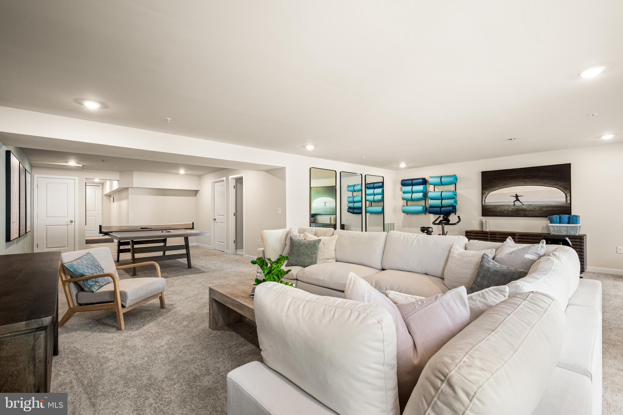 548 Arrowgrass Lane New Castle, DE 19720 - Photo 40 of 48 a living room with furniture and a flat screen tv