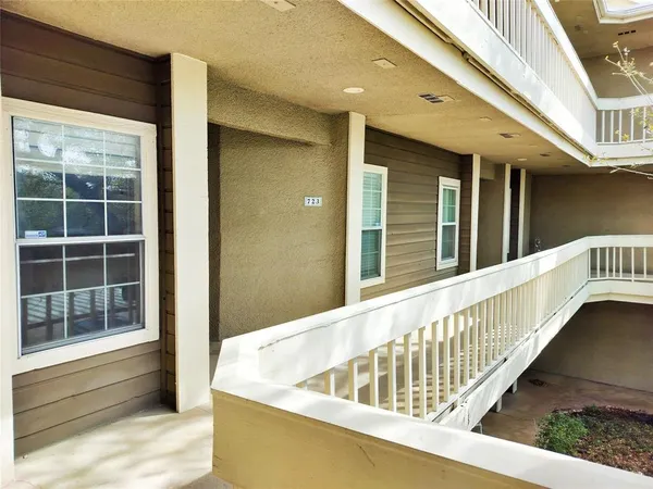 a view of balcony with a potted plant