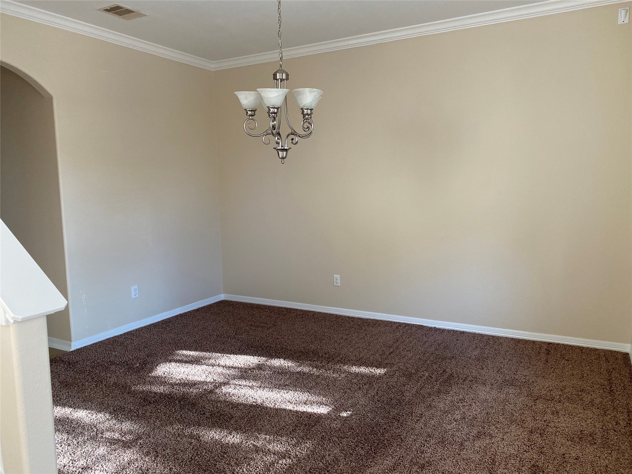 10930 Reston Point Drive Richmond, TX 77406 - Photo 13 of 26 a view of a room with a hanging light and kitchen view