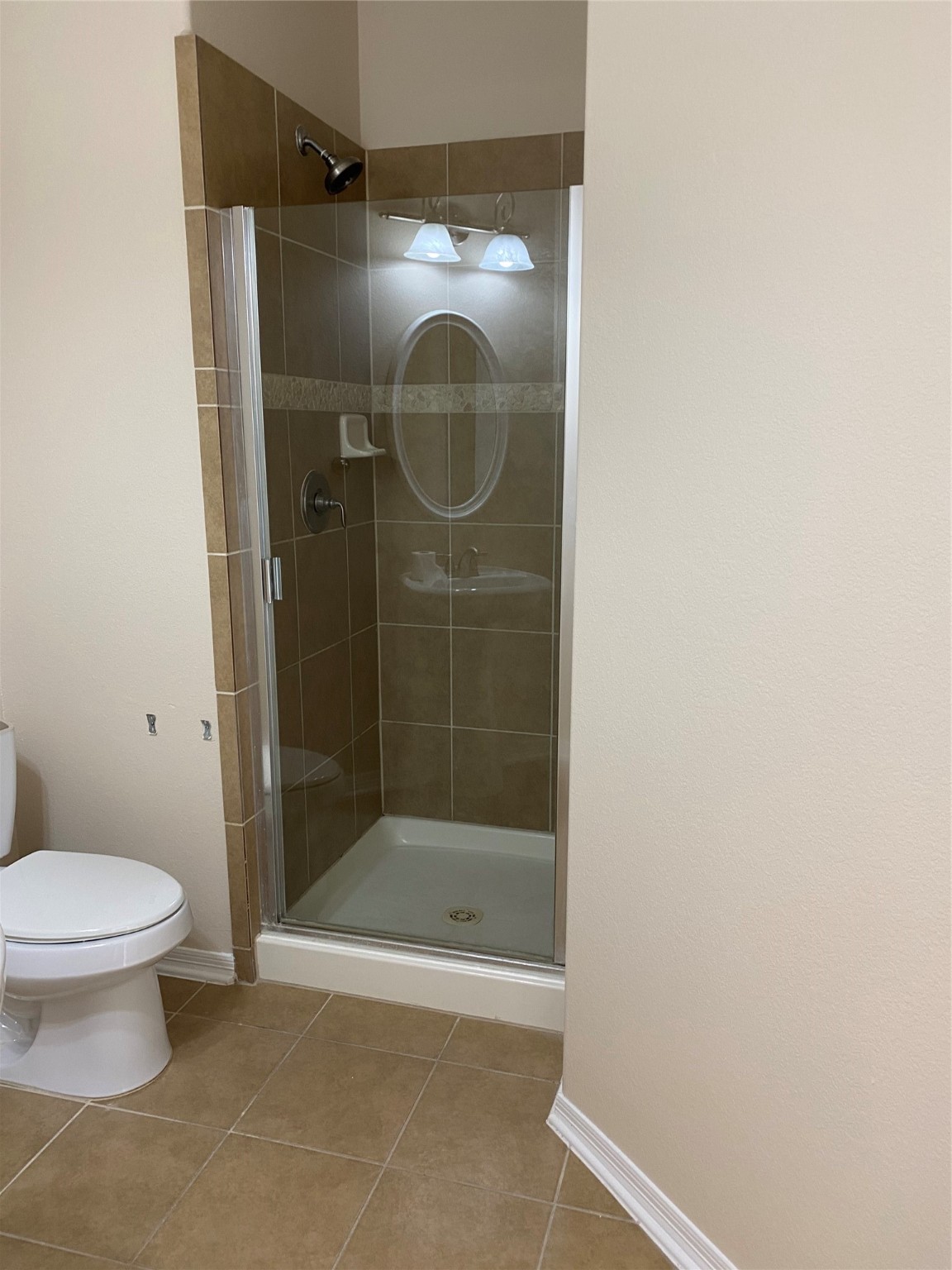 10930 Reston Point Drive Richmond, TX 77406 - Photo 15 of 26 a bathroom with a shower and a toilet