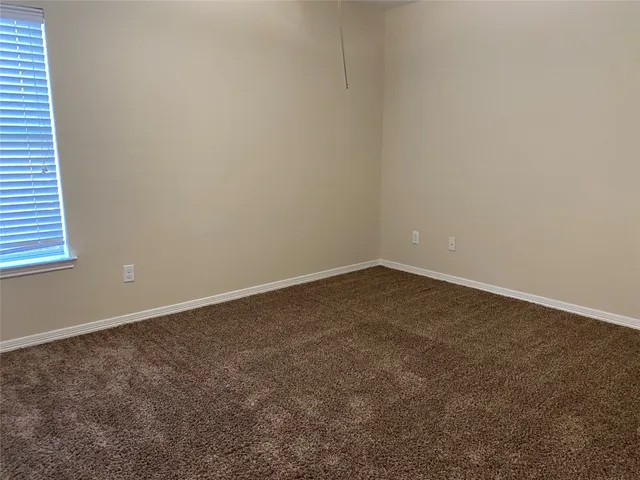 an empty room that has a window