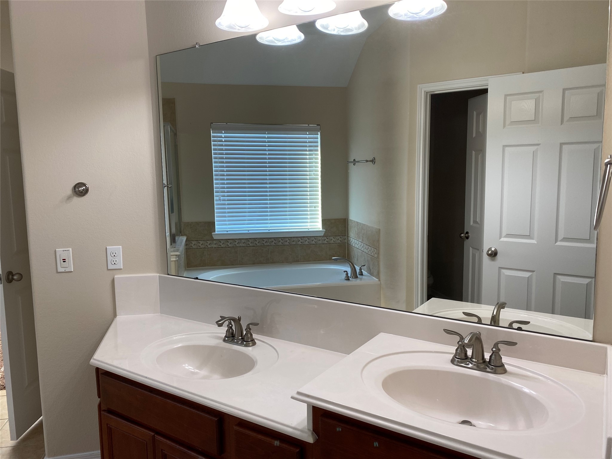 10930 Reston Point Drive Richmond, TX 77406 - Photo 19 of 26 a bathroom with a sink and a mirror