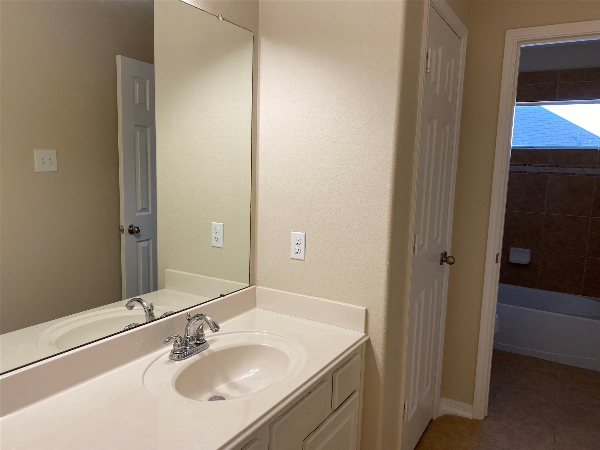 10930 Reston Point Drive Richmond, TX 77406 - Photo 21 of 26 a bathroom with a sink and a mirror