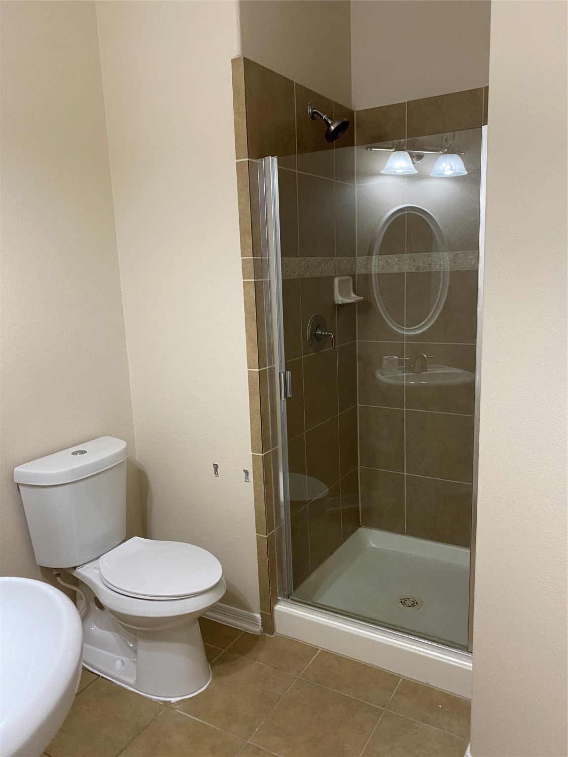 10930 Reston Point Drive Richmond, TX 77406 - Photo 22 of 26 a bathroom with a toilet and a shower