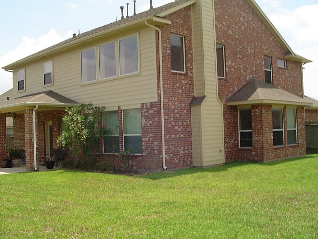 10930 Reston Point Drive Richmond, TX 77406 - Photo 26 of 26 front view of a house with a yard