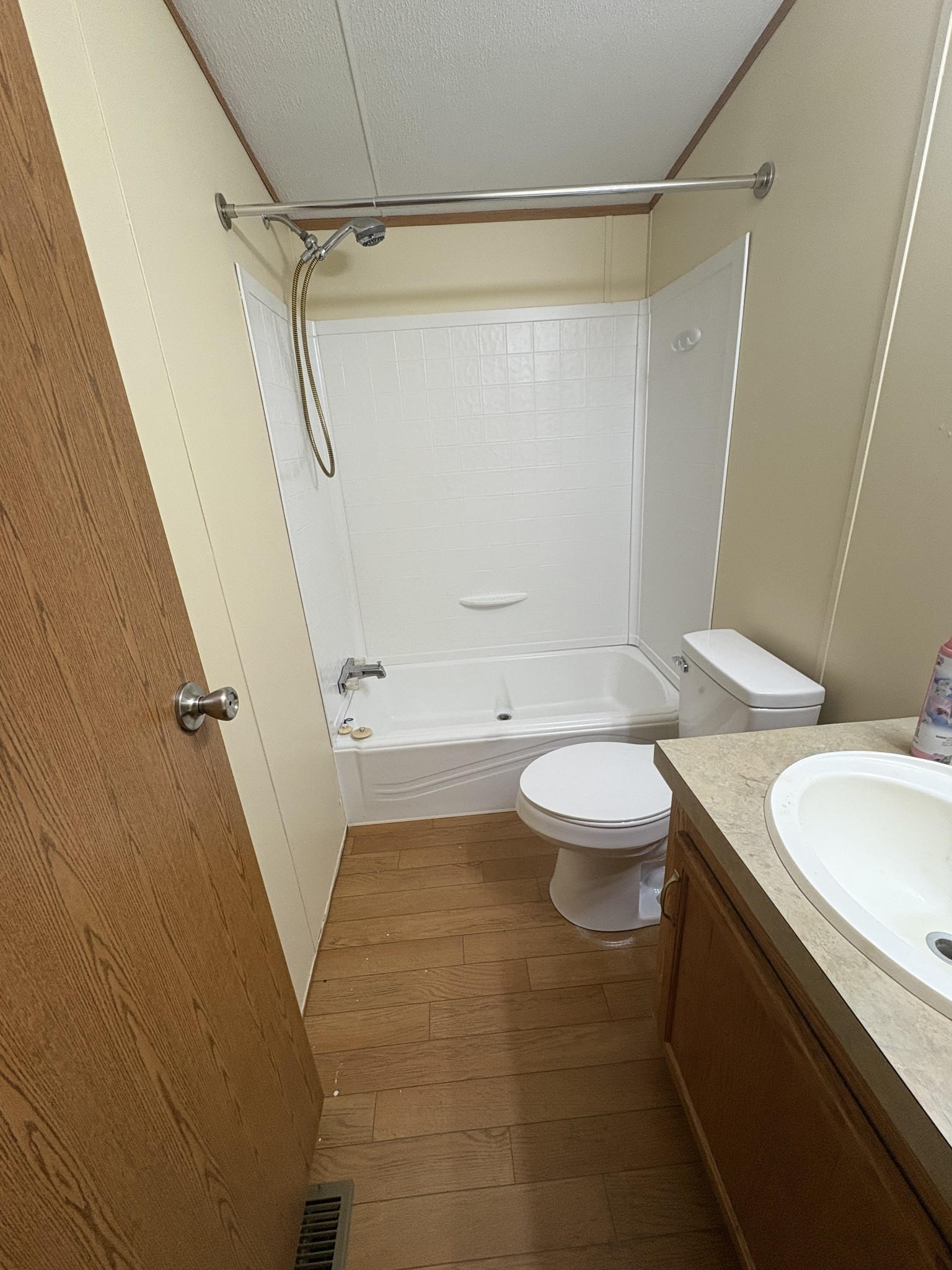 131 Laurel Trails Road Monteagle, TN 37356 - Photo 10 of 13 a bathroom with a sink a toilet and a shower curtain