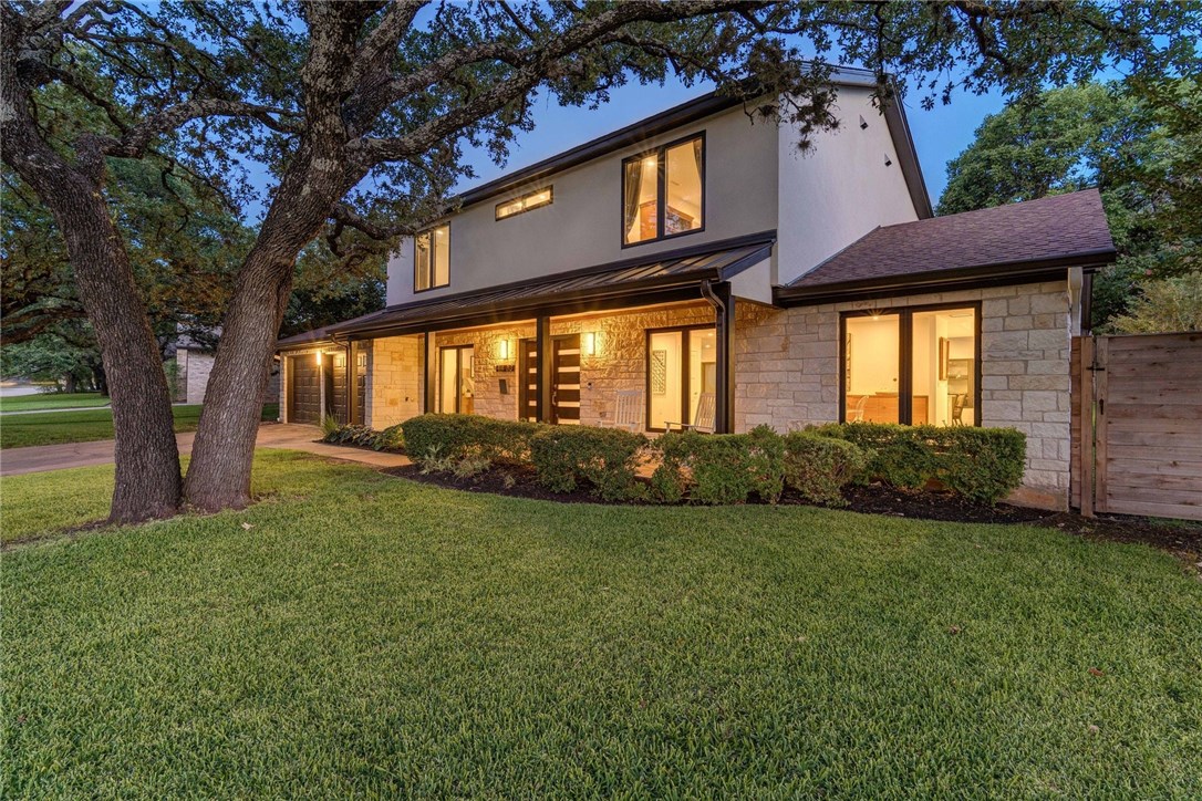 4403 Greystone Drive Austin, TX 78731 - Photo 1 of 1 a view of a yard in front of a house with large tree