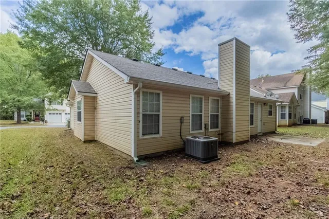 a view of a patio with a chairs and table