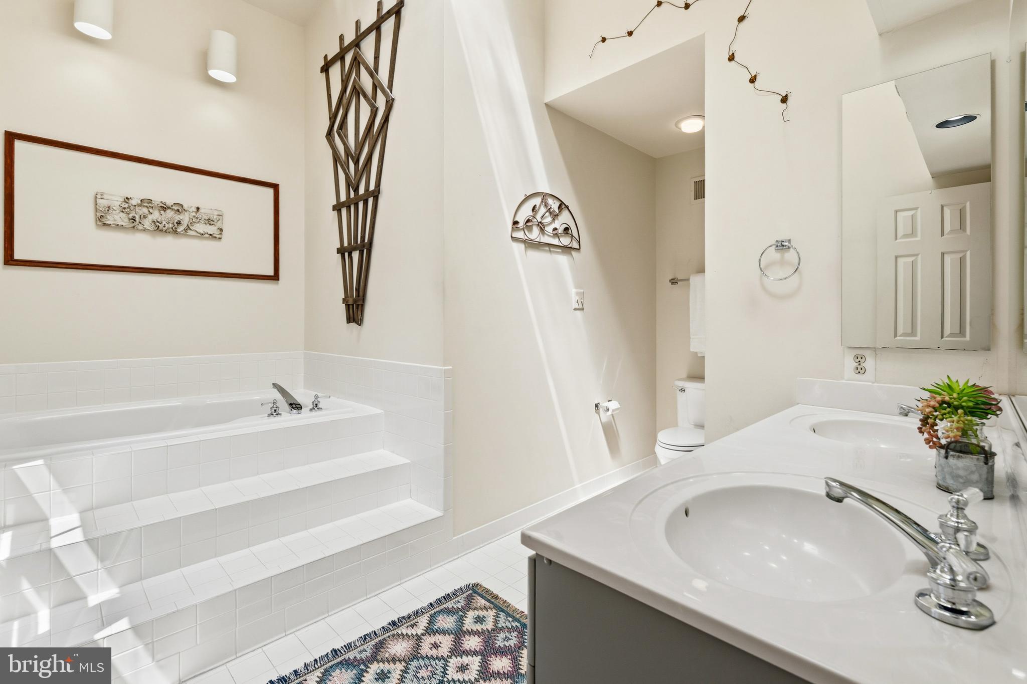 6518 Milva Lane Springfield, VA 22150 - Photo 33 of 55 Spa-like primary bath featuring a soaking tub