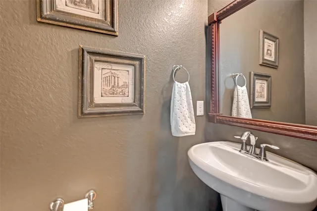 a bedroom with a bed and a tv