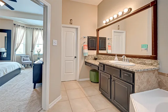 a bathroom with a tub and a sink