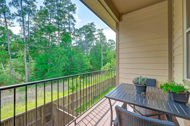 a view of a balcony with furniture