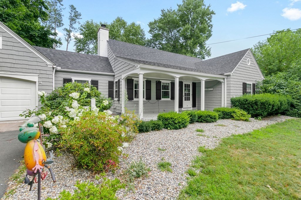 24 Puritan Road Springfield, MA 01119 - Photo 3 of 42 a front view of a house with a garden
