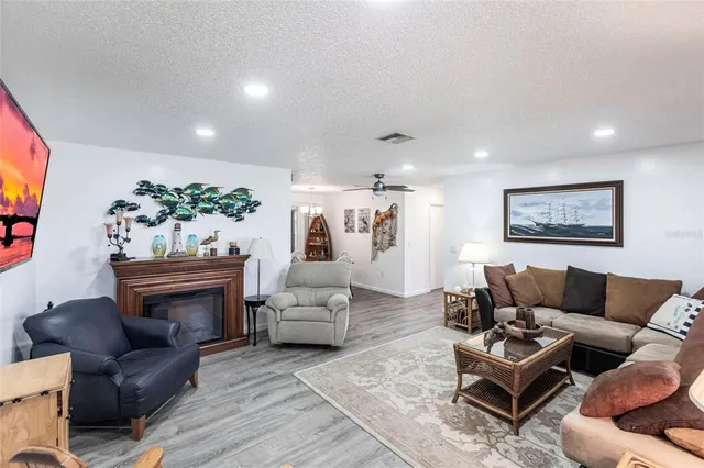 a living room with furniture or couch and a fireplace