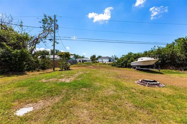 a view of a swimming pool with an outdoor space and seating area