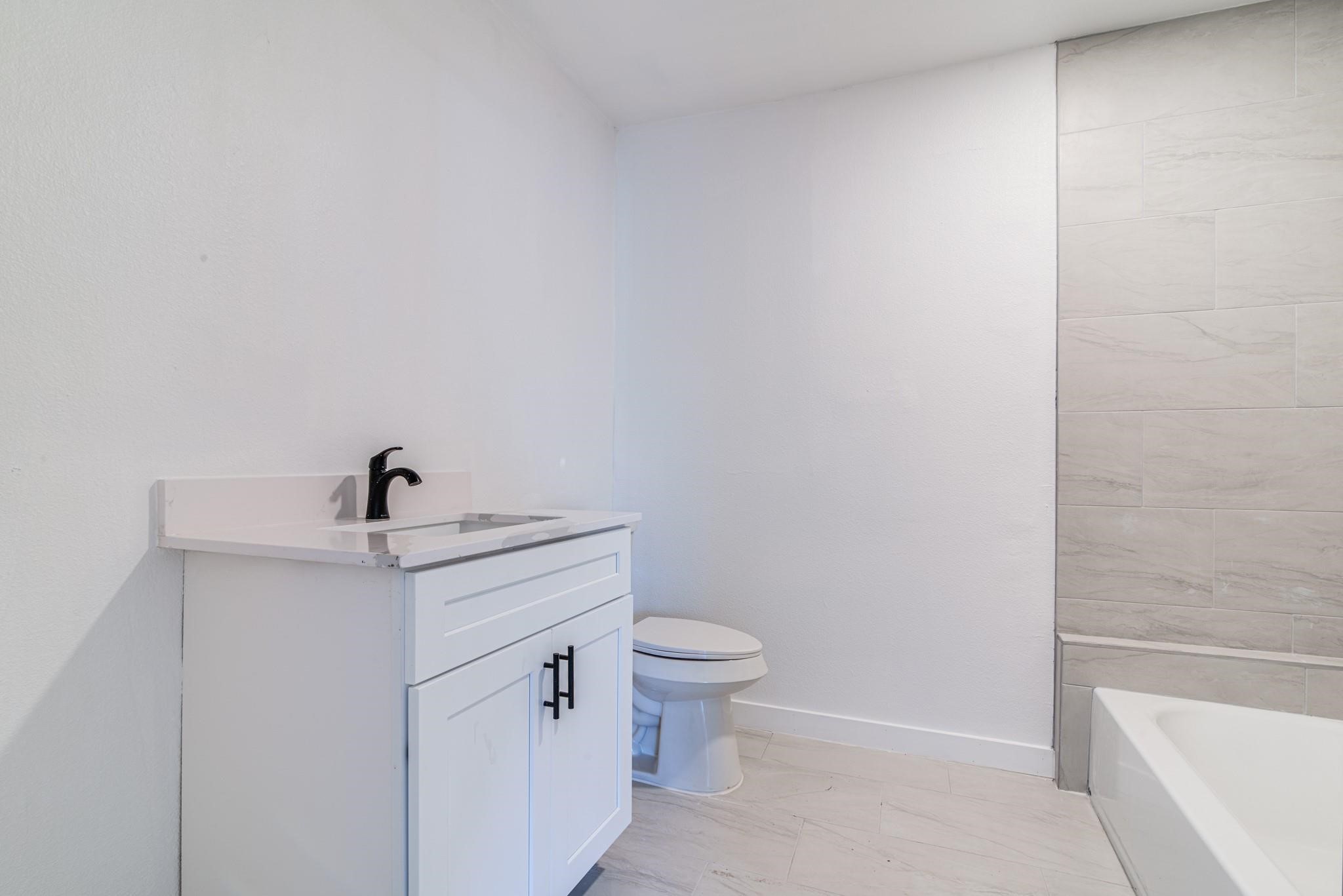 1105 North Valderas Street Angleton, TX 77515 - Photo 11 of 17 a view of bathroom with a sink and toilet